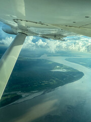 View from the window of the plane as it passes by the Rio Negro and Solimões. 
Country: Brazil, Careiro (Amazonas)
