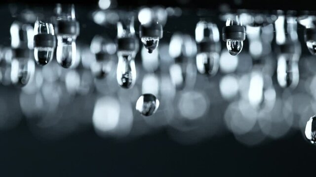 Super Slow Motion Shot of Water Droplets Falling From Shower Head at 1000fps.