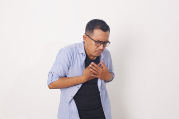 Heart attack concept. Young man suffering from chest pain. Isolated on white background