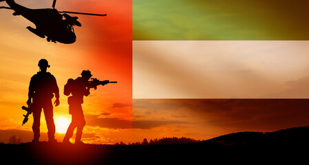 Fototapeta na wymiar Silhouette of soldiers against the flag of UAE. Concept of national holidays.