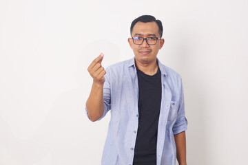 Naklejka premium Asian man standing while hold something. Isolated on a white background