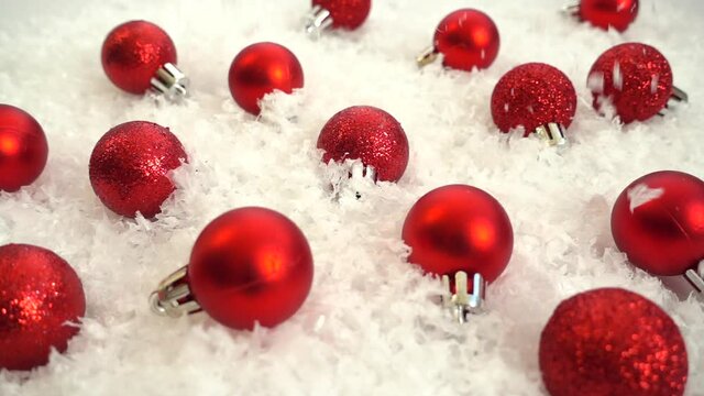 Falling snow on Christmas toys. Decorative background. Slow motion.