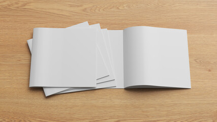 Square brochure or booklet mock up on wooden background.