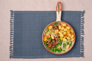 Baked gnocchi with stews and vegetables.