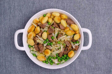 Baked gnocchi with stews and vegetables.