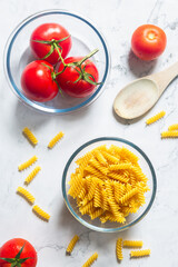 Fusilli pasta with tomato, black pepper and olive oil