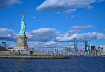 Statue of Liberty with Manhattan skyline in the distance