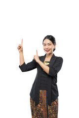 beautiful woman wearing traditional Javanese clothes pointing copy space