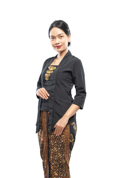 Indonesian woman with beautiful face wearing Kebaya standing looking at camera