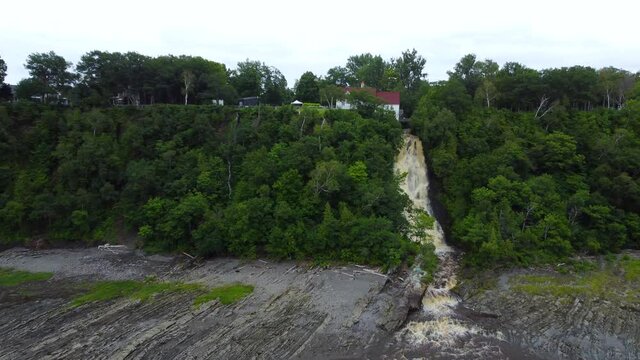 Mailloux Waterfall Gushing on Cliff on Saint Lawrence River in Beaumont, Quebec - Aerial