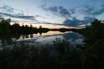 dark sunset on the river in Russia