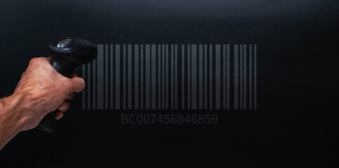 Barcode concept. Retail label barcode scan. Reader laser scanner for warehouse on black background. Warehouse inventory management.