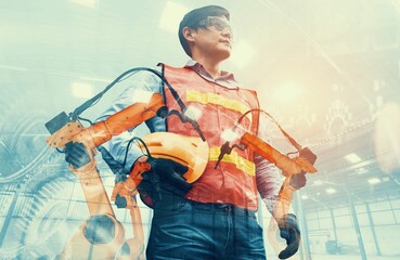 Mechanized industry robot arm and factory worker double exposure . Concept of robotics technology...