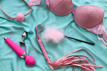 Different sex toys on bed