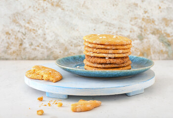 Plate with delicious chocolate cookies on light table