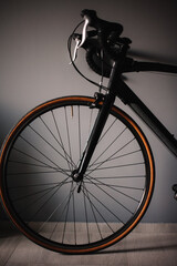 Fototapeta na wymiar Bicycle against grey wall at home