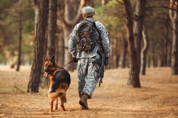 Soldier with military working dog outdoors