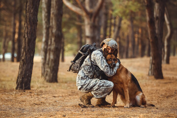 Soldier hugging military working dog outdoors