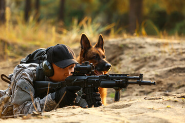 Soldier with military working dog during combat operation outdoors