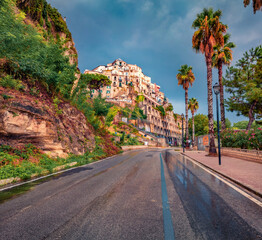 Landscape photography. Gloomy morning cityscape of Tropea town after the rain, Italy, Europe. Beautiful summer scene of east coast of Calabria. Traveling concept background.