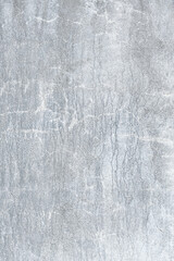 drips of white paint on a cement wall