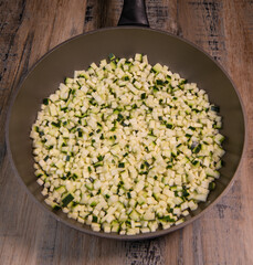 Chopped raw zucchini, close-up, diced zucchini macedonia