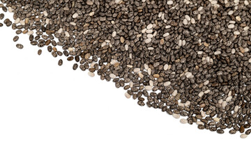 Many black chia seeds randomly placed from the top. Macro. Top view of tiny black and white  oval shaped chia seeds. Also known as Salvia hispanica, chian or chien. Isolated on white. Selective focus.