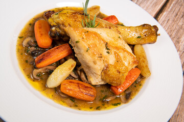 Chicken Hunter recipe with glazed root vegetables, carrot, turnip with its mushroom sauce deglazed in white wine and wet with the chicken stock
