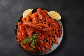 Red boiled crawfishes on table in rustic style. Asian Chinese Food Spicy Crayfish