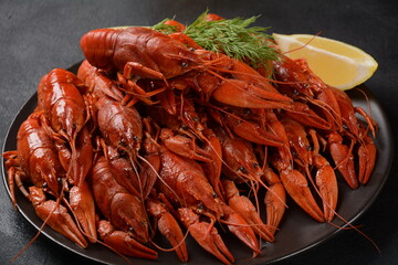 Red boiled crawfishes on table in rustic style. Asian Chinese Food Spicy Crayfish