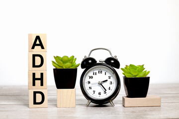 ADHD. text on wooden boards on a white background on a wooden table