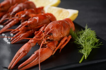 Red boiled crawfishes on table in rustic style. Asian Chinese Food Spicy Crayfish