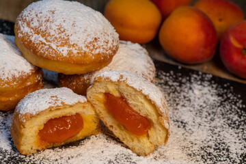 Freshly cooked Apricot jam doughnuts, referred to as jelly doughnuts, donuts in the US