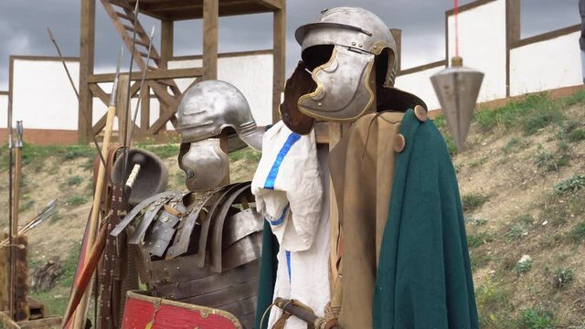 Helmet and armor, Scutum shield, Gladius sword - Roman legionary soldier metal equipment. Military of ancient Rome