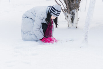Oriental girls playing in the snow in winter