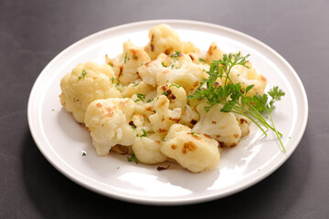 grilled cauliflower and parsley in plate