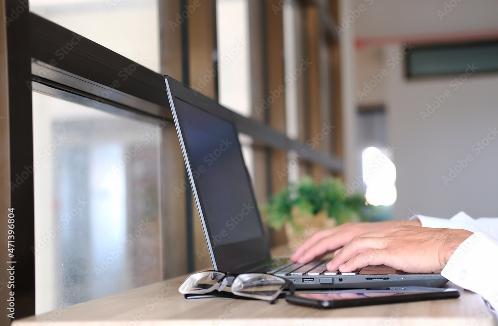Poster businessman is working on a laptop computer with big data analytics visualization technologies, exam