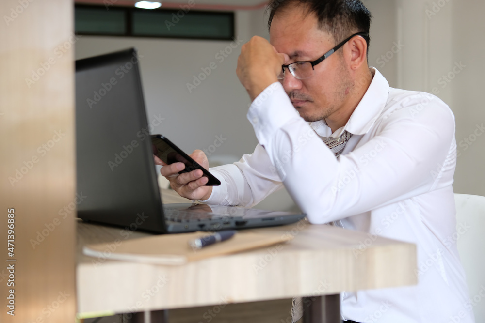 Poster concept of unrecognisable businessman using a laptop while working remotely, hands working on modern