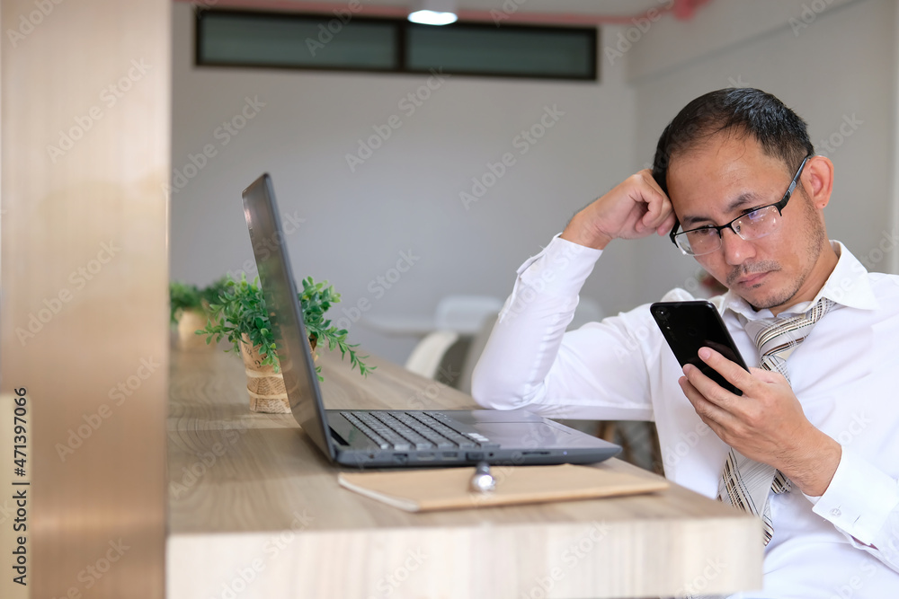 Poster concept of a businessman using a smartphone on a desk and technology