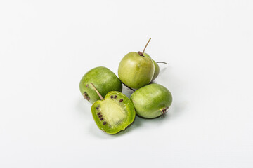 Ripe Actinidia arguta or kiwi isolated on white background