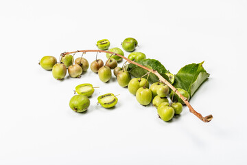 Ripe Actinidia arguta or kiwi isolated on white background