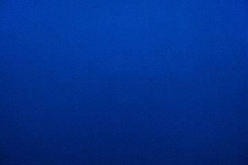 Navy blue abstract background. Gradient. Silk fabric surface texture. Elegant background with copy space for design.