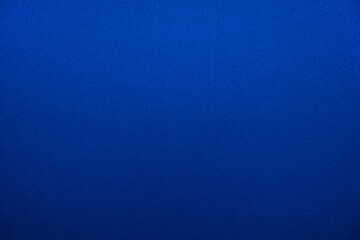Navy blue abstract background. Gradient. Silk fabric surface texture. Elegant background with copy space for design.