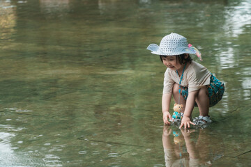 Girls playing with water in Huanglongxi scenic spot