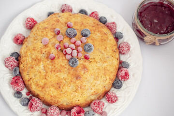 Banana pie with berries on a white background