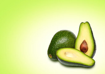 Composition of ripe avocados on a bright background.