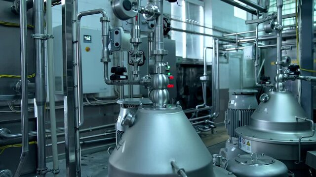 Interior of dairy factory with fermentation tank. Technology equipment at dairy farm. Sterile production