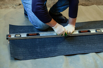 Material for waterproofing, measuring and cutting roofing tape for protection against moisture.