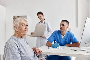 Fototapeta premium elderly patient communication with a doctor in the medical office