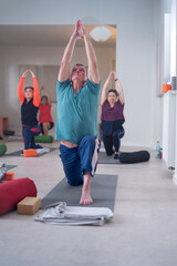 Group of people of different ages doing stretches.